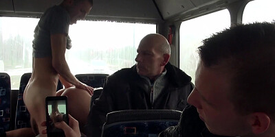 A blonde is getting fucked hard in the bus while people are looking