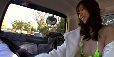 Japanese babe reveals a bikini under her coat, sucks dick in car