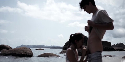 Asian cutie is blowing a complete stranger at the beach