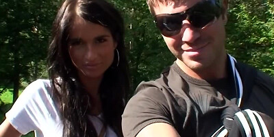 The amateur couple is taking a hike in the nearby forest
