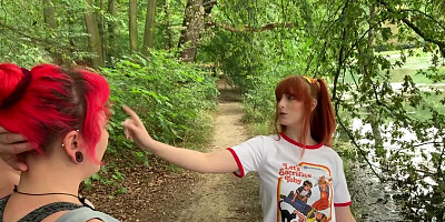 Ginger lady is posing for a photo session in the woods
