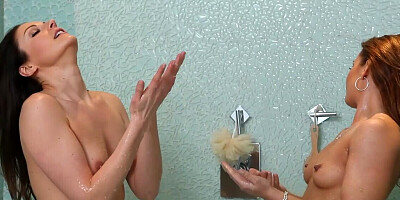Fine bitches play slutty oral games under the warm shower