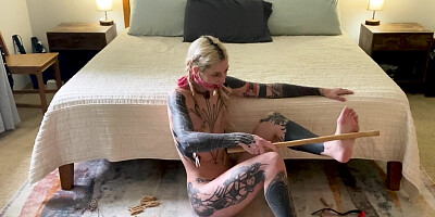 Ball-gagged inked girl is flogging herself on live webcam