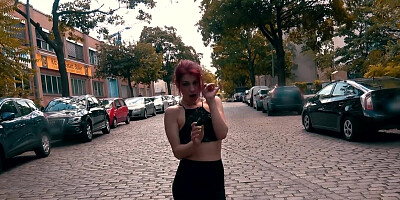Exhibitionistic redhead girl is sucking a hard cock on the street