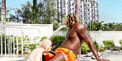 Sexy blonde tries black cock at the pool during her naughty holiday