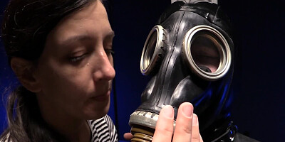 Gimp with a mask is being tortured by a perverted mistress