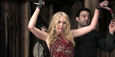Blonde girl is tied up with belts by a perverted master