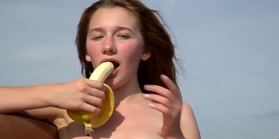 Teaser showing off her body while on a yacht and eating