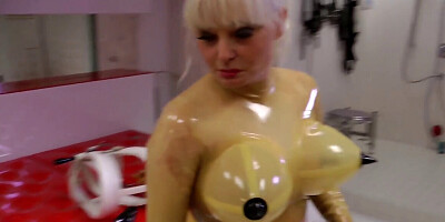 Slave in latex is bound and tortures by a depraved mistress