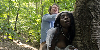 Ebony bride and white groom are having sex in the woods