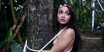 A nature girl is tied up and fucked in the forest by some trees