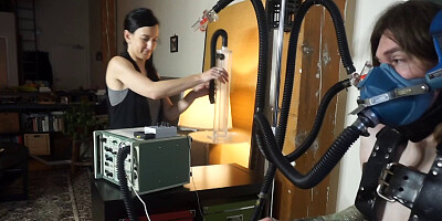Tied up gimp is tortured by a perverted brunette mistress