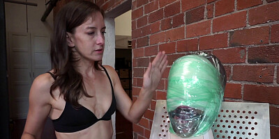 Gimp is wrapped up and stimulated with a Hitachi toy