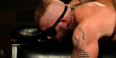 Submissive man is tied and used by a tattooed domina