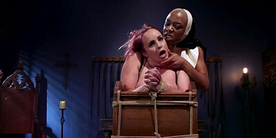 Black nun does white sinner's pussy with fingers and strapon