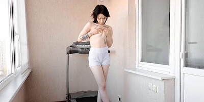 Pale brunette babe Karolina Geiman goes on the balcony
