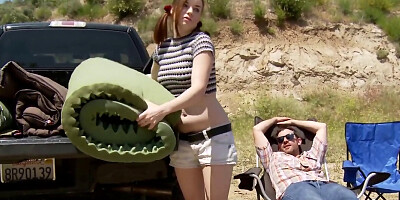 Redheaded camper slut takes on two guys by the tents
