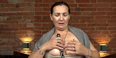 European granny plays with her tits and teases her muff