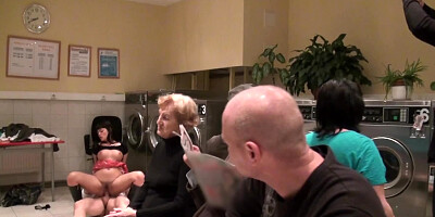 Shameless brunette and man practice sex in the crowded laundry