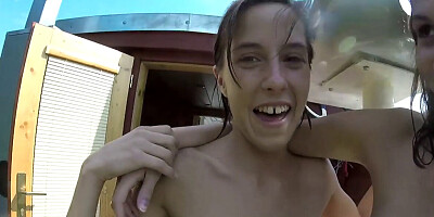 Hot chicks are naked while swimming in the lake together