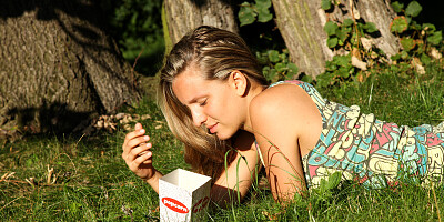 Cute blonde with natural breasts gets wet in the field