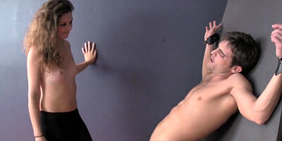 Evil daughter taunting and ballbusting trussed prisoner