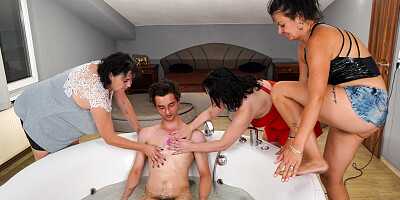 Three busty brunettes blow and ride one lucky stud in tub