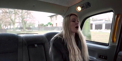 A blonde woman in red lingerie is drilled in the cab