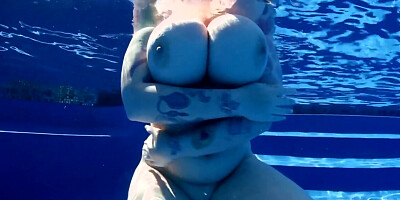 BBW babe shows off huge naturals in the pool underwater POV