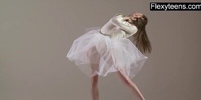 Blonde gymnast performs gymnastics