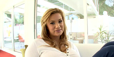 A sexy woman with massive tits and an ass to match them is sucking balls