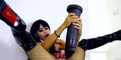 Exotic woman in fishnets slams that huge sex toy inside