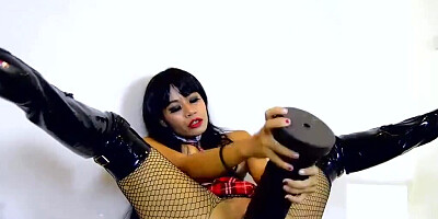 Exotic woman in fishnets slams that huge sex toy inside