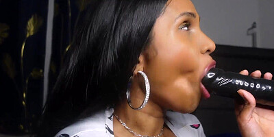 Amateur brunette Indian is sucking on a big black toy
