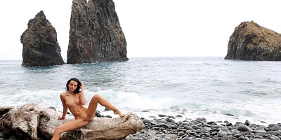 Young Sapphira shows off her body on the beach