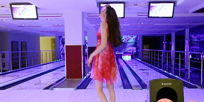 Brunette cutie stripped naked at the bowling alley