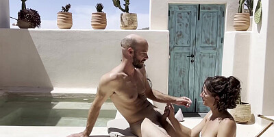 Bald man and his busty girlfriend recording a video