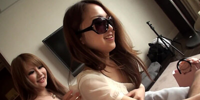 Two hot Asian babes give blowjob to a stranger