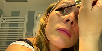 Ugly mom fondles her boobs while putting her make up on