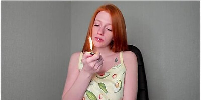 Redhead smoking, sensual and alluring