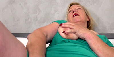 Mature woman is feeling horny so she masturbates