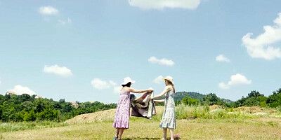 Eve Black and Amanda Clarke are 69ing in a field