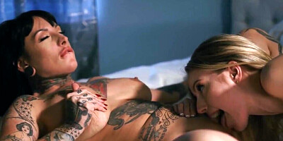 Brunette with tattoos has lesbian sex in the bedroom