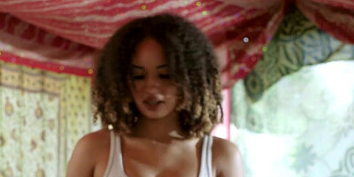 Exotic babe with curly hair is giving a sensual massage