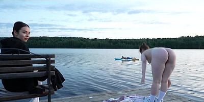 Two women strip at the lake and fuck a surprised surfer