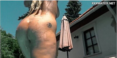 Petite blonde and charming model swim together