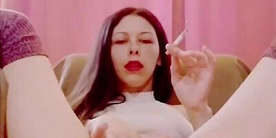 Pleasuring herself while savoring a smoke