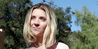 Bends over in the garden with teen