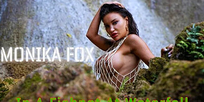 Wet Monika Fox in a Fishnet at Waterfall