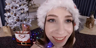 Playful girl masturbates near New Year's tree in VR video